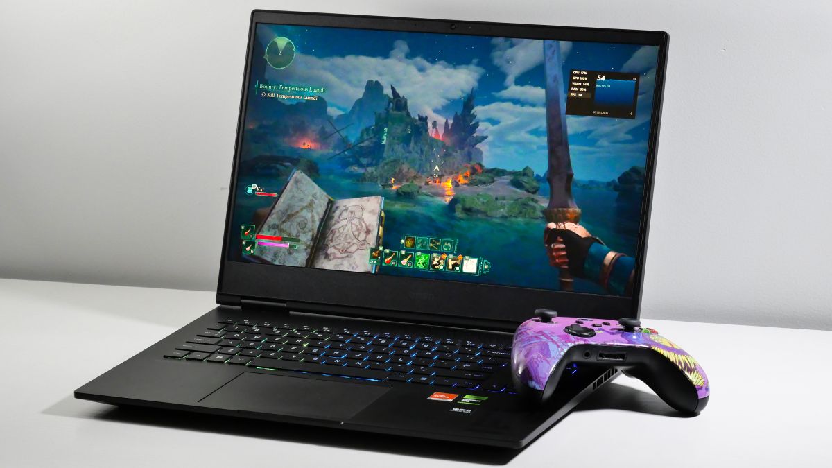 HP Omen 16 open on a white table next to a purple Xbox Series X controller. The image highlights the game Avowed which is displayed on screen.