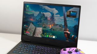 HP Omen 16 open on a white table next to a purple Xbox Series X controller with Avowed playing on screen.